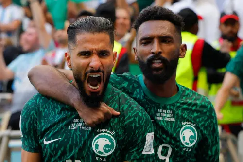 Saudi Arabia's forward Saleh Al-Shehri celebrates with Firas Al-Buraikan after scoring | AFP