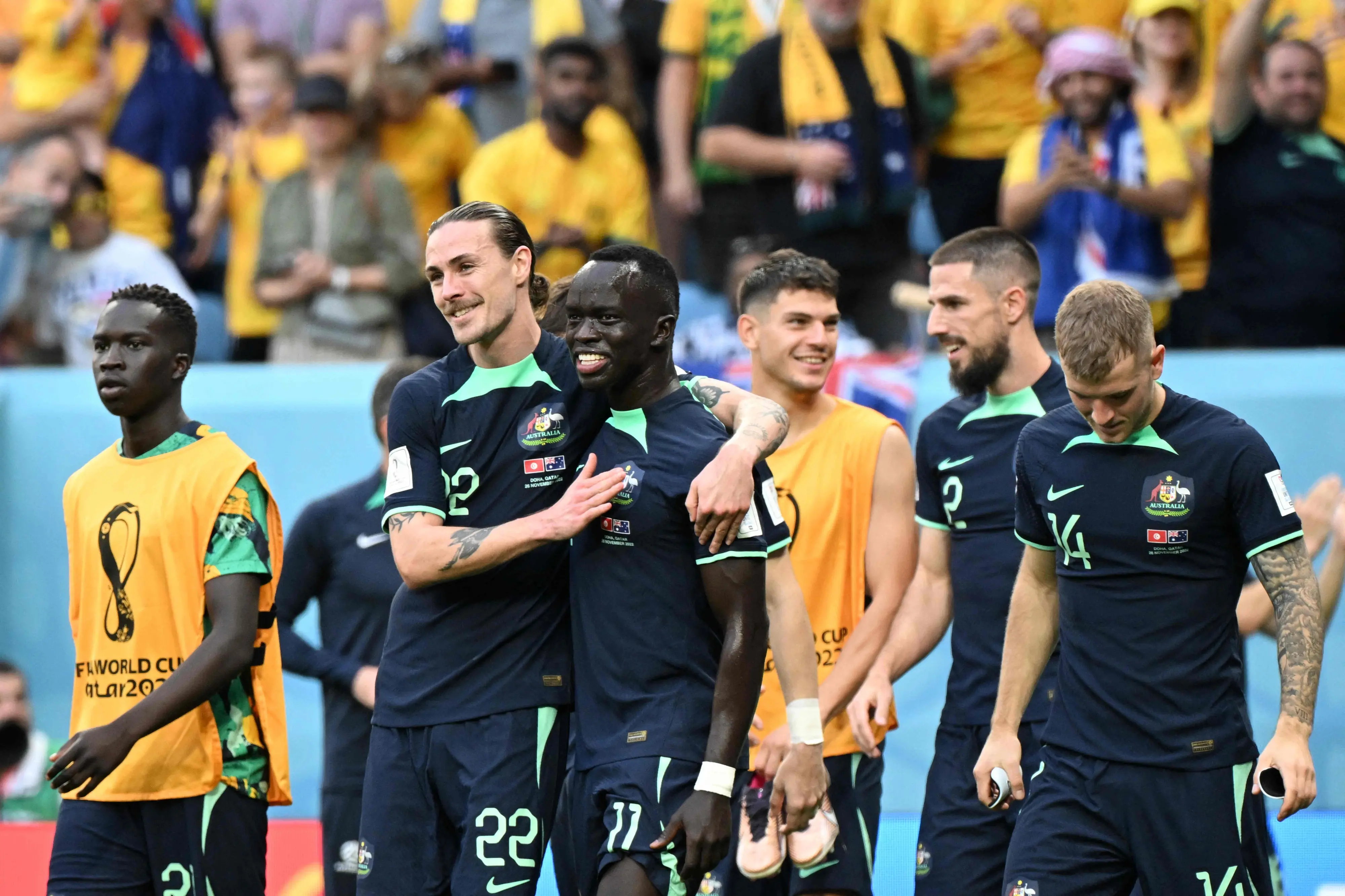 Australian players celebrate after defeating Tunisia | Photo: AFP