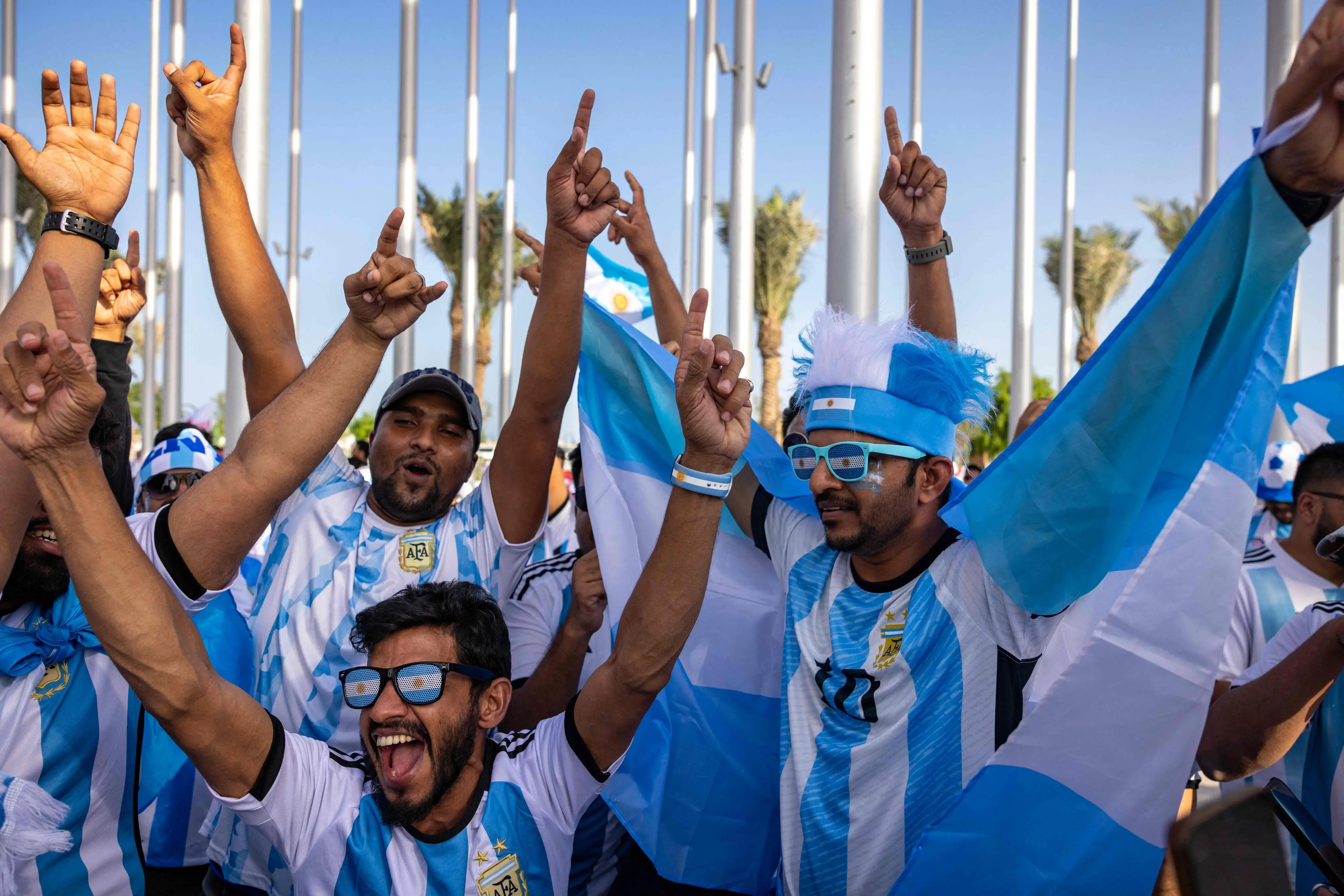 Football fans supporting Argentina cheer in Doha on November 11, 2022, ahead of the Qatar 2022 FIFA World Cup football tournament | Photo: AFP