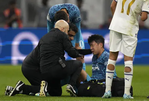 Son Heung-min receives treatment after taking a knock | AP