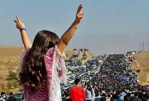 This UGC image posted on Twitter reportedly on October 26, 2022 shows an unveiled woman standing on top of a vehicle as thousands make their way towards Aichi cemetery in Saqez, Mahsa Amini's home town in the western Iranian province of Kurdistan, to mark 40 days since her death, defying heightened security measures as part of a bloody crackdown on women-led protests. - A wave of unrest has rocked Iran since 22-year-old Amini died on September 16 following her arrest by the morality police in Tehran for allegedly breaching the country's strict rules on hijab headscarves and modest clothing | Photo: UGC / AFP)