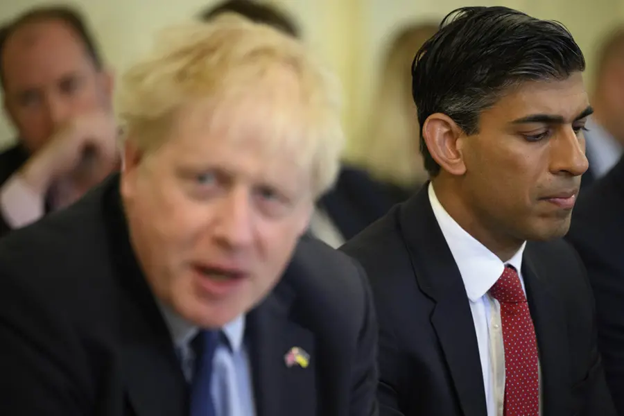 Johnson returns to UK as Sunak qualifies for PM race