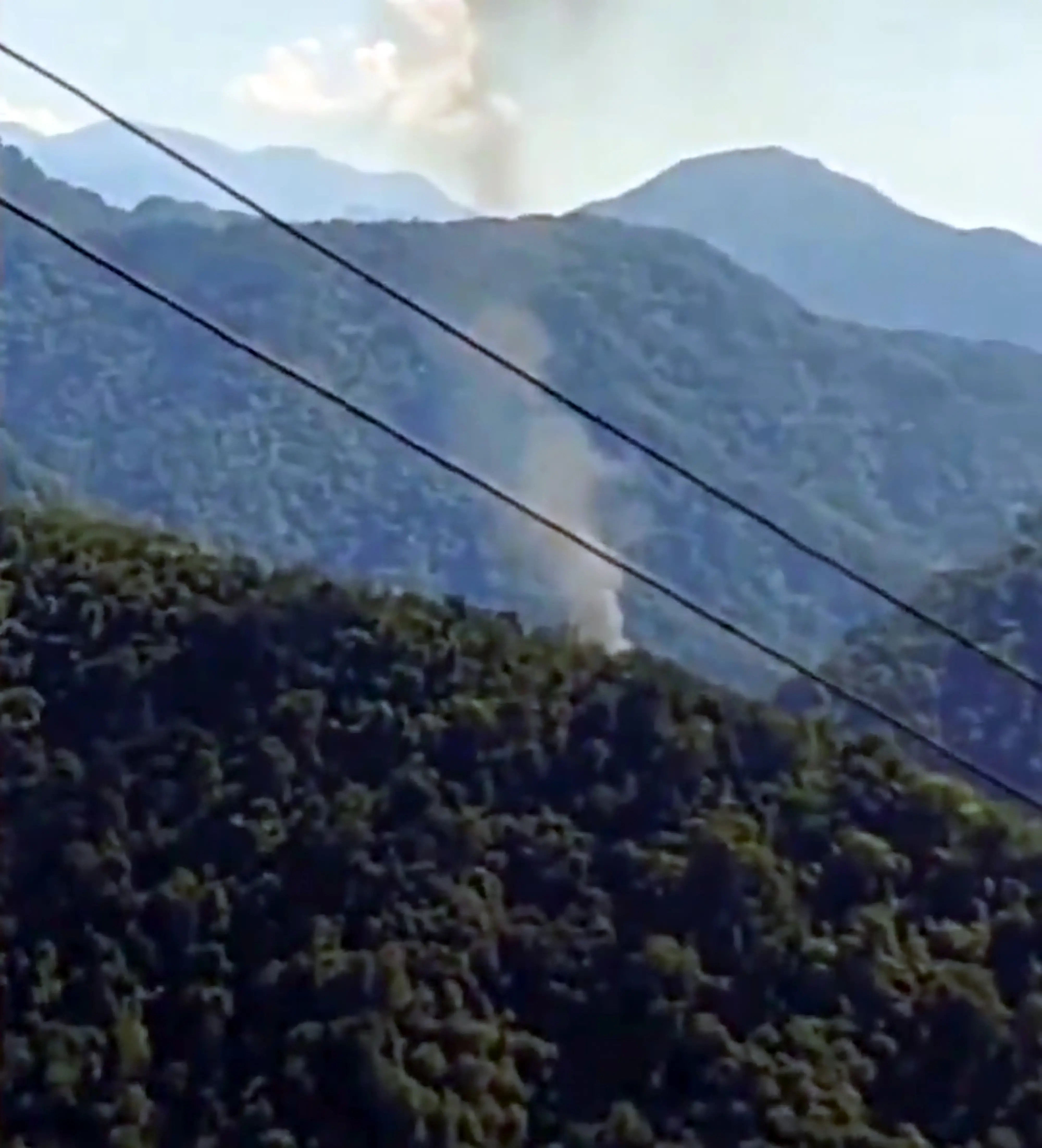 Smoke billows after an advanced light helicopter of the Indian Army crashed at Migging in Upper Siang district of Arunachal Pradesh, Friday, Oct. 21, 2022 | Photo: PTI