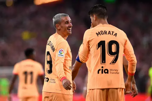 Antoine Griezmann celebrates with Alvaro Morata after scoring his team's first goal | AFP