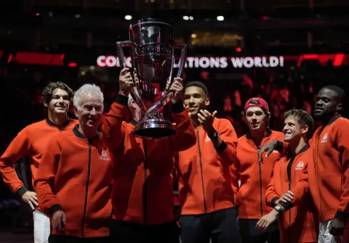 Team World's members celebrate with the trophy | AP
