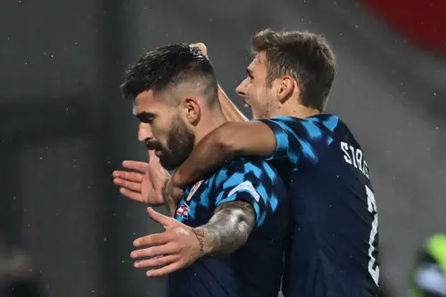 Croatia's forward Marko Livaja (L) celebrates scoring his team's second goal | AFP