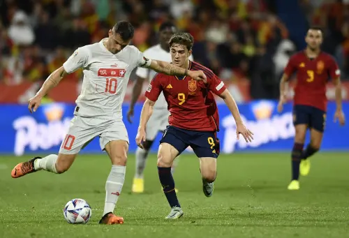 Granit Xhaka, left, challenges for the ball with Spain's Gavi during the match | AP