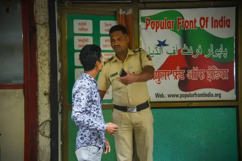 A security person keeps vigil outside the Popular Front of India (PFI) party office in Navi Mumbai, Thursday, Sept. 22, 2022. A multi-agency operation was spearheaded by the National Investigation Agency (NIA) on the PFI in 11 states for allegedly supporting terror activities in the country | Photo: PTI