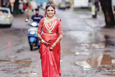 Bride turns model for photo shoot protest against pothole-filled roads in Malappuram