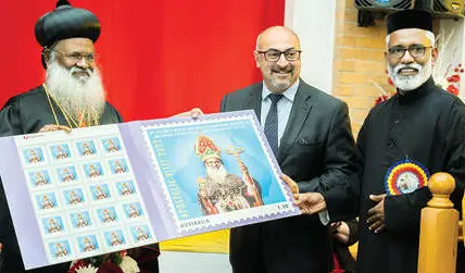 Peter Khalil releases stamp with Metropolitan Baselios Marthoma Mathews III