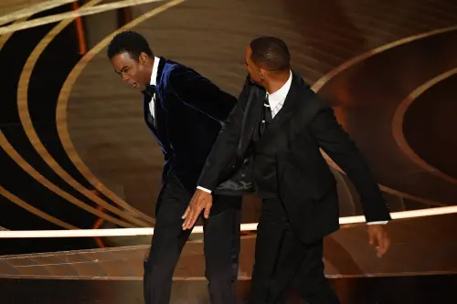 US actor Will Smith (R) slaps US actor Chris Rock onstage during the 94th Oscars at the Dolby Theatre in Hollywood, California on March 27, 2022 | Photo: AFP
