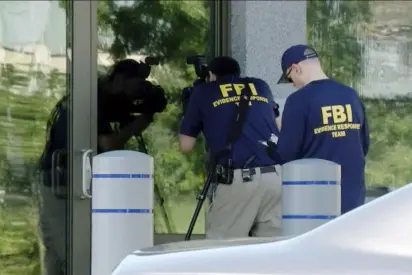 Armed man killed after trying to breach FBI office, standoff