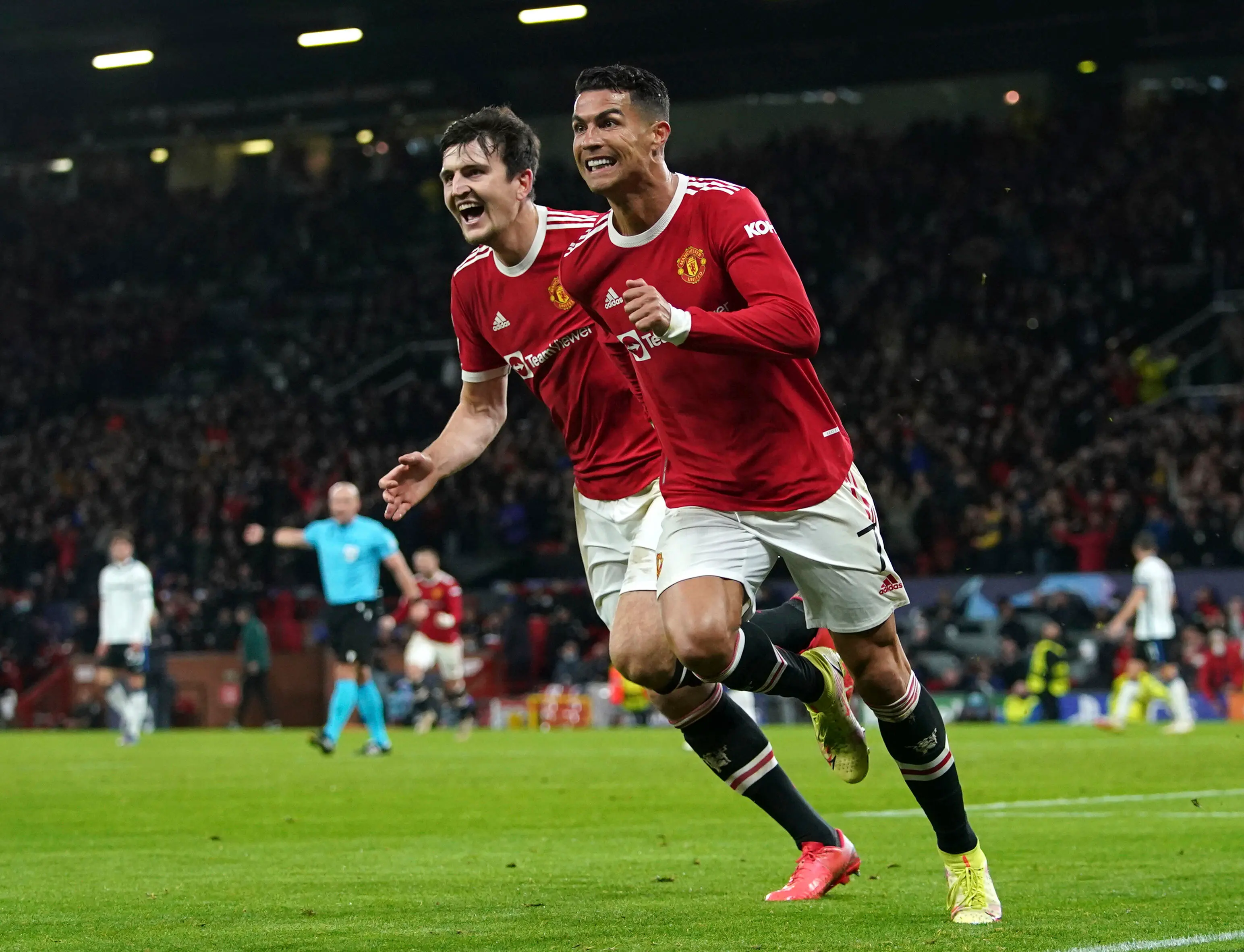 Cristiano Ronaldo, right, celebrates after scoring with Harry Maguire I AP