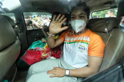 Mirabai Chanu arrives back in India I Photo: ANI