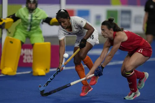 India's Vandana Katariya (16) , left and Wales' Xenna Hughes challenge vie for the ball during the pool A women's hockey match between India and Wales at the Commonwealth Games in Birmingham, England, Saturday, July 30, 2022 | Photo: AP