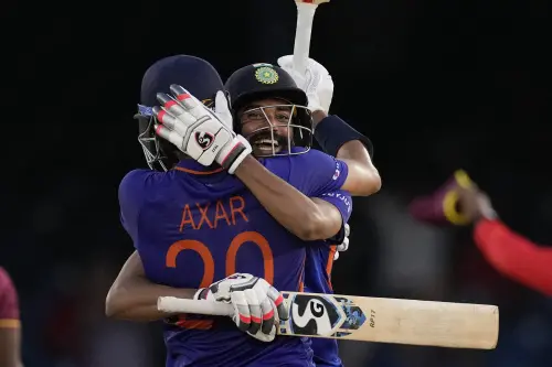 Axar Patel is embraced by teammate Mohammed Siraj | AP