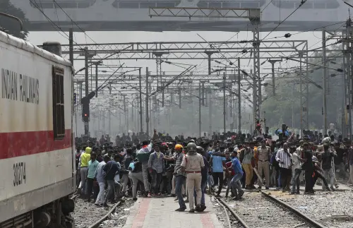 Protesters throw stones at a train at Secunderabad railroad station | AP