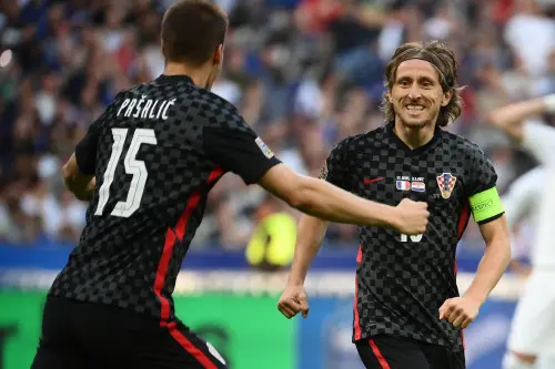 Luka Modric (R) celebrates his team's first goal on a penalty kick | AFP