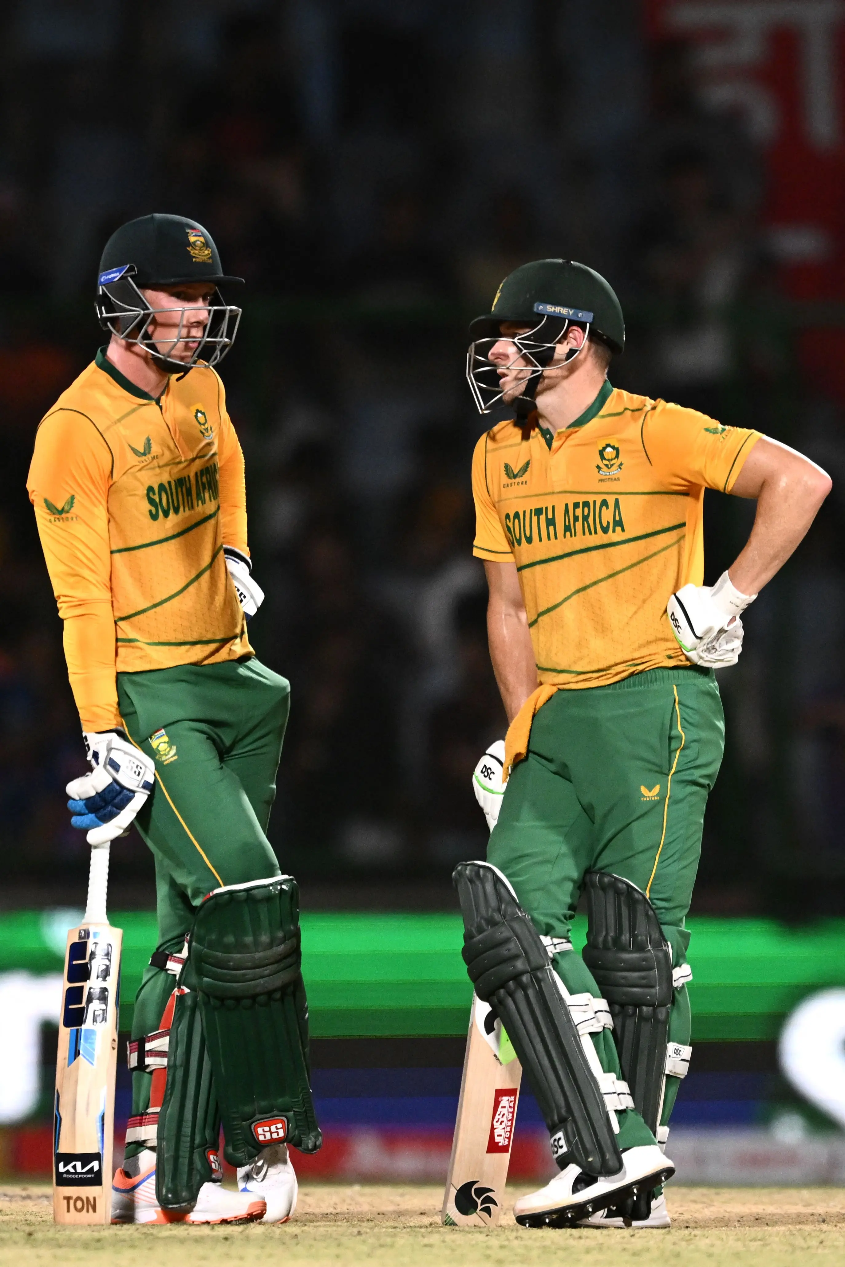South Africa's Rassie van der Dussen (L) speaks with his teammate David Miller during the first Twenty20 international cricket match between India and South Africa at the Arun Jaitley Stadium in New Delhi