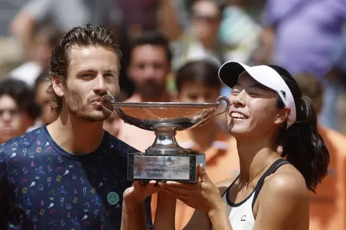 Ena Shibahara, right, and Netherlands' Wesley Koolhof hold the cup | AP