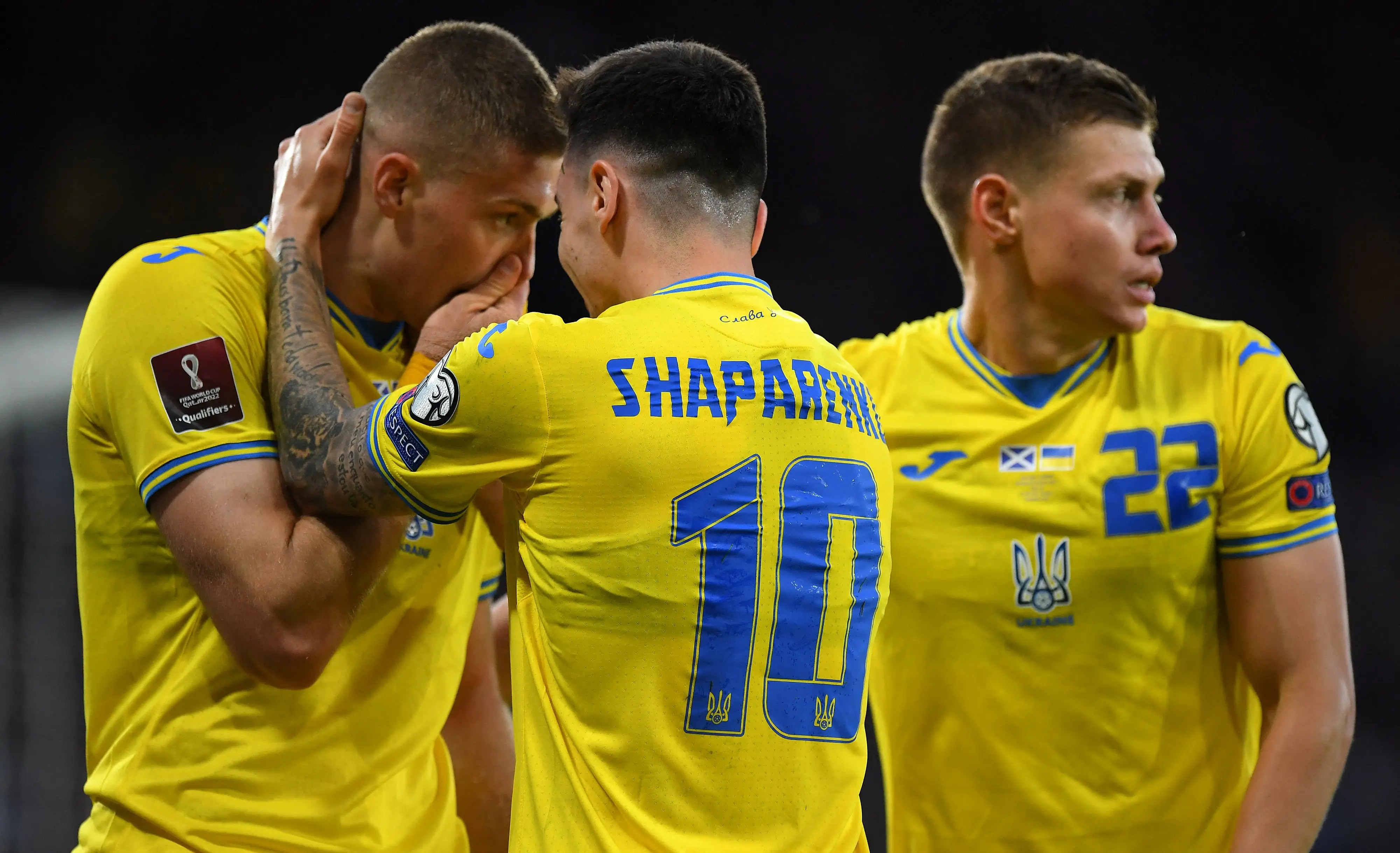 Ukraine's striker Artem Dovbyk (L), Ukraine's midfielder Mykola Shaparenko and Ukraine's defender Mykola Matviyenko react after the FIFA World Cup 2022 play-off semi-final qualifier football match between Scotland and Ukraine | Photo: AFP