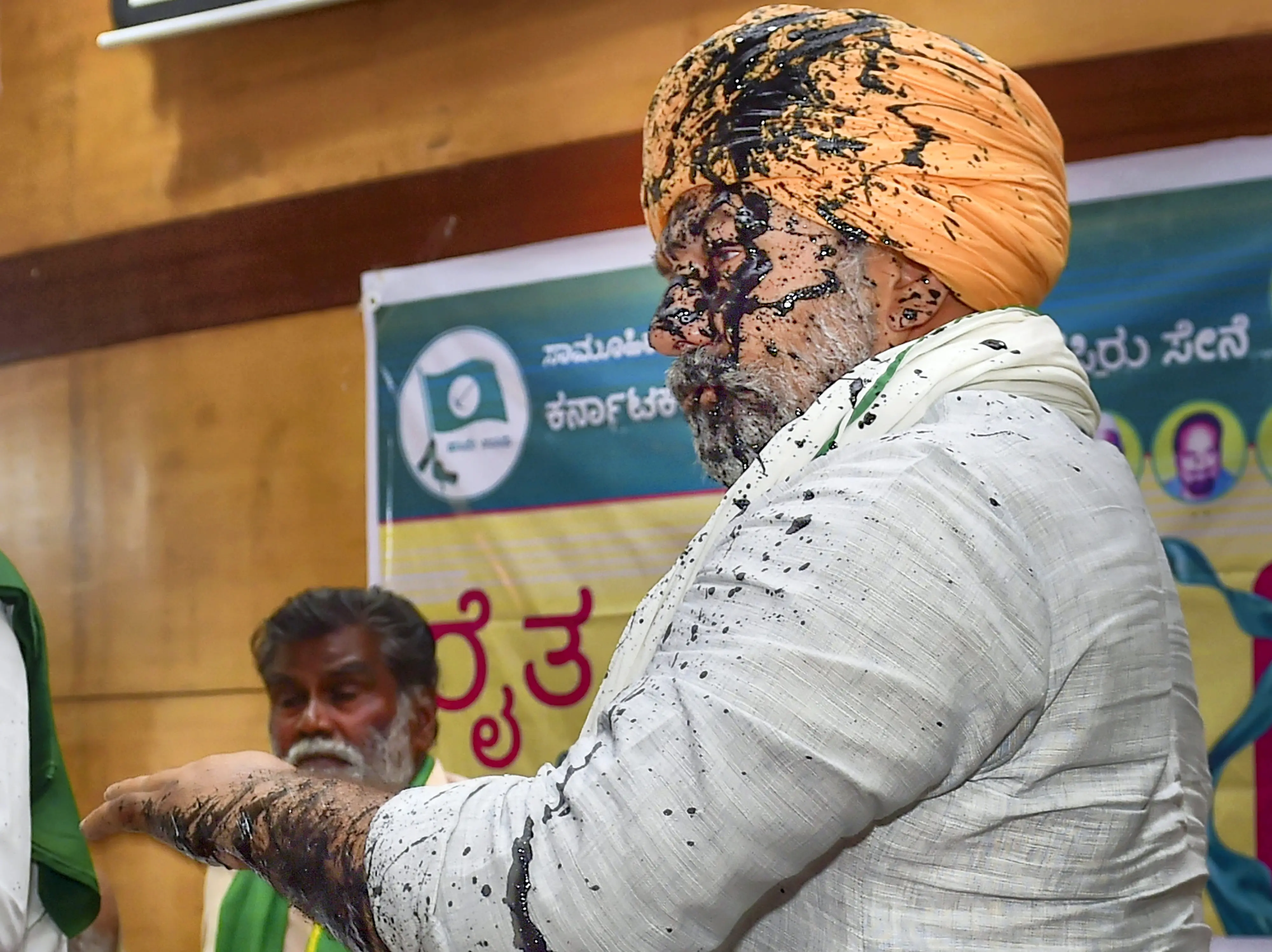 BKU Spokesperson and farmer leader Rakesh Tikait after an unidentified person threw ink on him, during an event, in Bengaluru. Photo: PTI