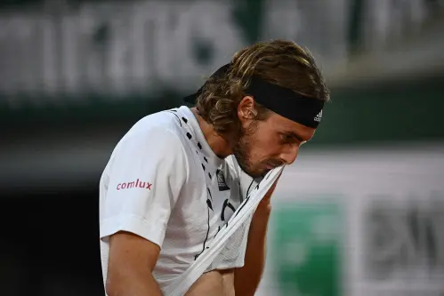 Tsitsipas in late night fightback to beat Musetti at French Open