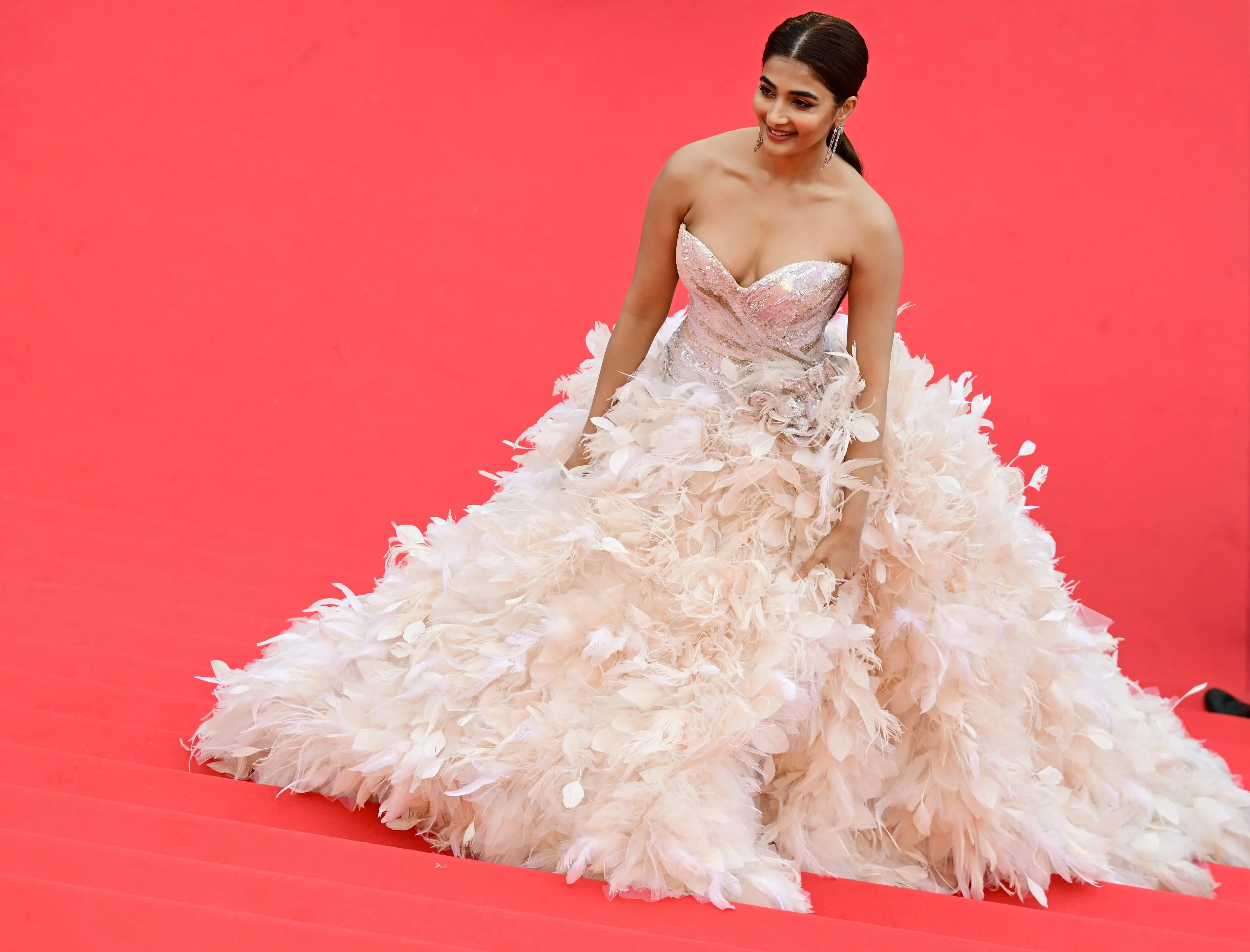Pooja Hegde arrives for the screening of the film 'Top Gun : Maverick' during the 75th edition of the Cannes Film Festival in Cannes. Photo: AFP