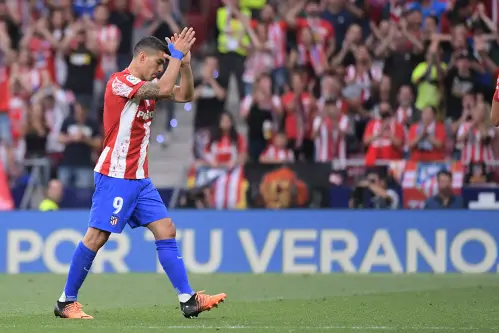 Suarez bids Atletico farewell as Sevilla qualify for Champions League