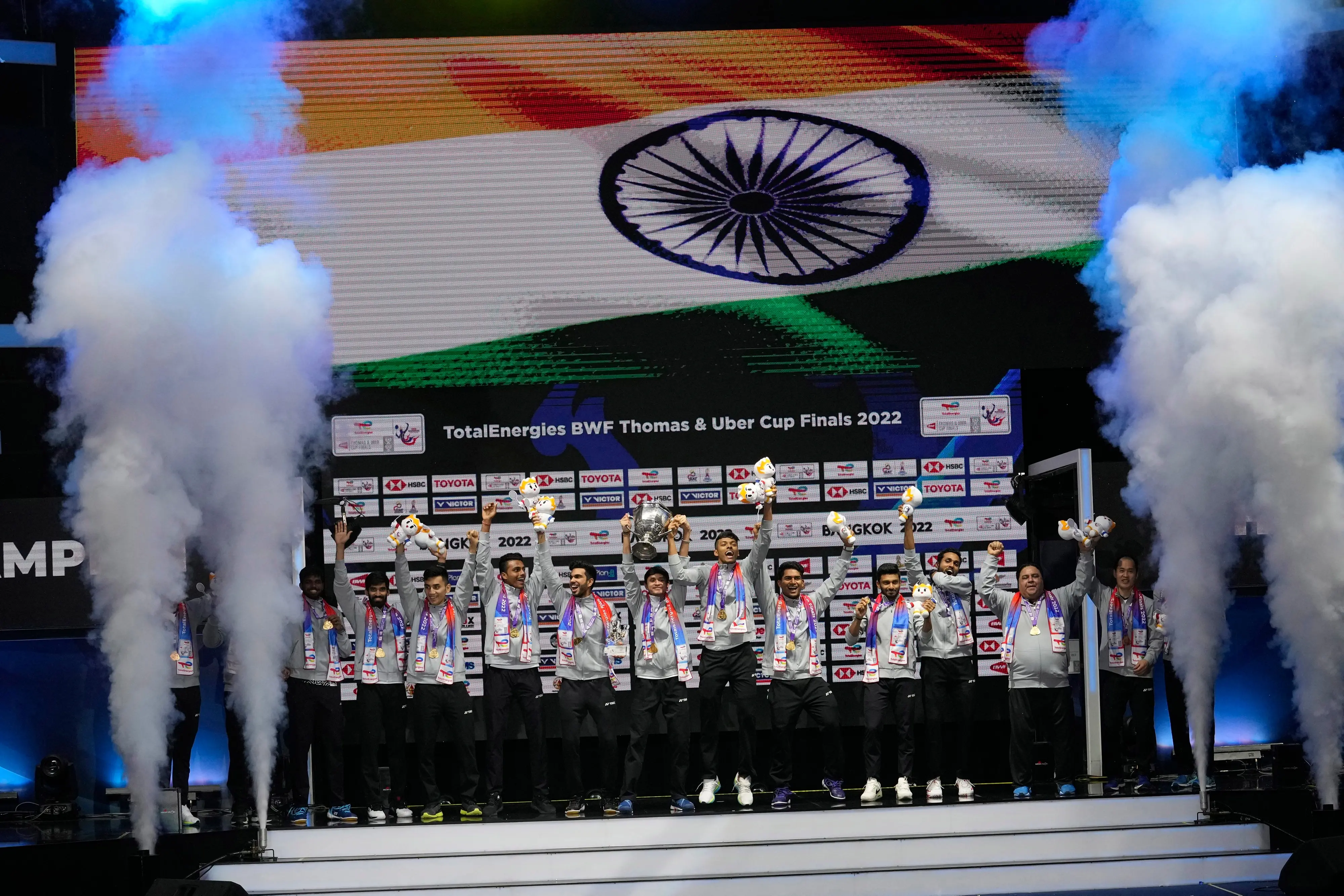 India's team members pose with their nation flag after winning Thomas Cup title in Bangkok. Photo: AP