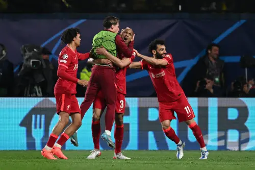 Fabinho celebrates with teammates after scoring a goal | AFP