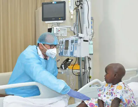 Dr Zainul Abid with the girl who underwent surgery
