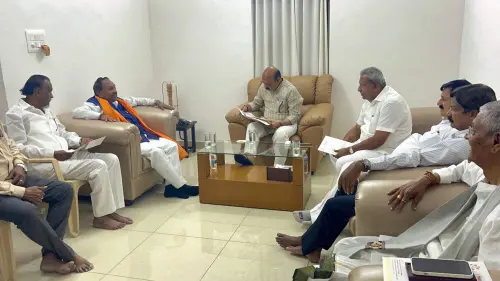 Karnataka CM Basavaraj Bommai with Minister K Eshwarappa (L) at his residence in Bengaluru, Friday, April 15, 2022 | Photo: PTI