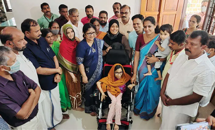 Minister R Bindu and others at Afra's house