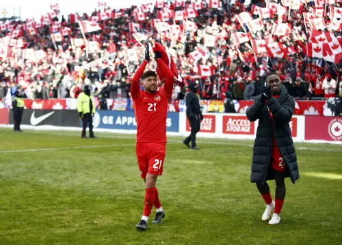 Jonathan Osorio(L) and Richie Laryea celebrate after the final whistle I AFP