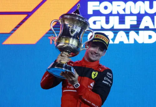 Charles Leclerc celebrates on the podium | AFP
