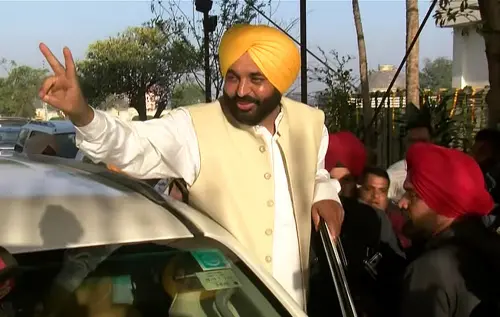 Aam Aadmi Party Chief Ministerial candidate for Punjab Bhagwant Mann waves to supporters as he comes to meet with Delhi Chief Minister and party convenor Arvind Kejriwal, at Civil Lines, in New Delhi on Friday. | Photo: ANI