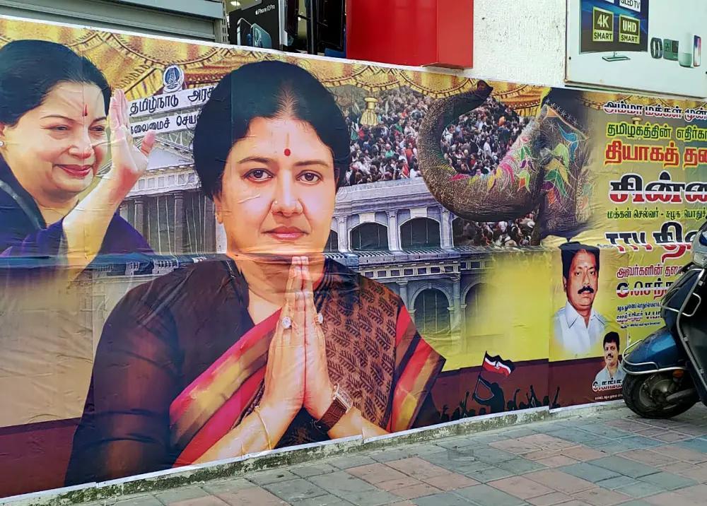 A large banner of Amma Makkal Munnettra Kazagam president VK Sasikala sticks at Krishna Priya's residence where she likely to stay after reaching Chennai | ANI