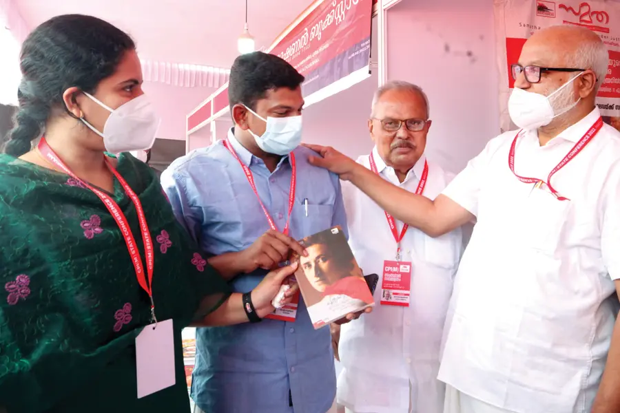 MA Baby gifts book to soon-to-be-wed couple Arya and Sachin at CPM state conference