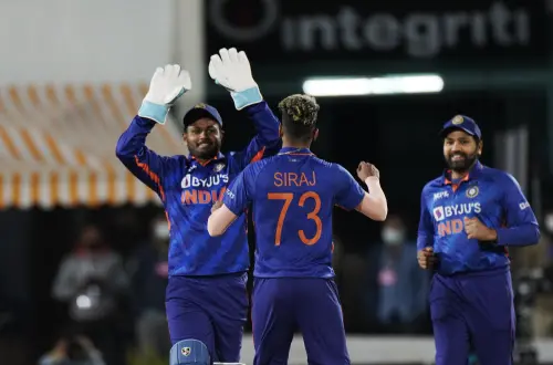 Indian players celebrate the dismissal of Sri Lanka's Danushka Gunathilaka during the third Twenty20 international cricket match in Dharmsala, India, Sunday, Feb. 27, 2022. | AP Photo