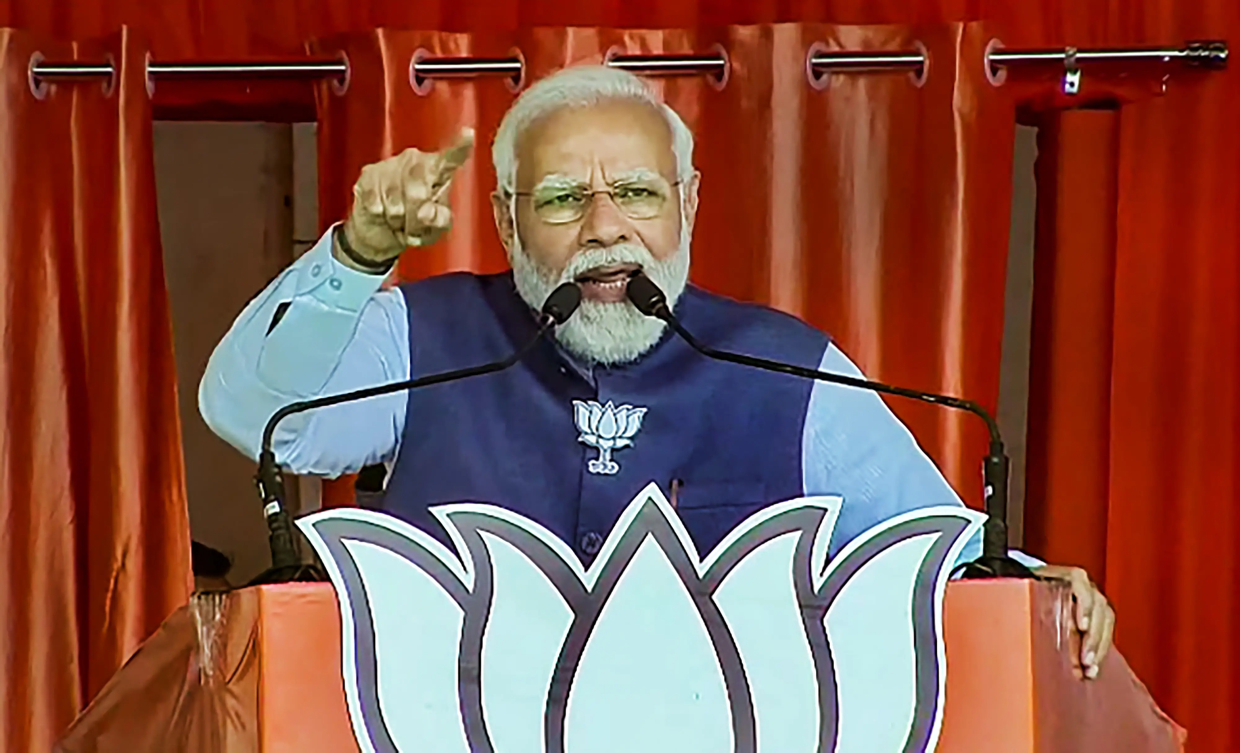 Prime Minister Narendra Modi addresses a public meeting, ahead of the upcoming state assembly elections, in Kanpur.