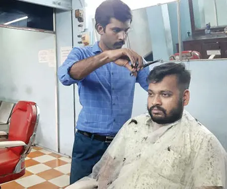 Dr Jettish Sivadas at his barbershop