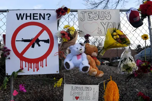 A sign calling for a ban on assault rifles in US I AFP