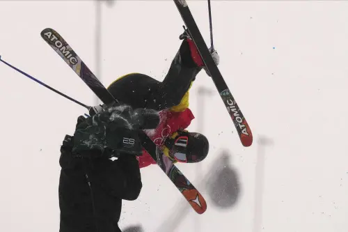 Jon Sallinen collides with a cameraman during the men's halfpipe qualification | AP