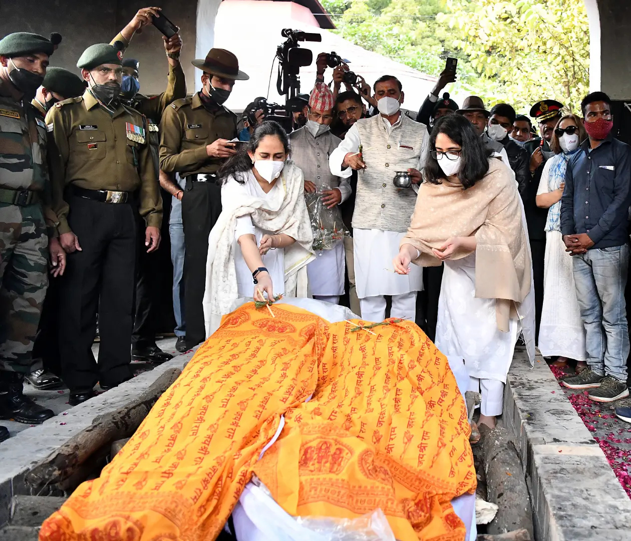 Daughters of the Chief of Defence Staff (CDS) General Bipin Rawat and his wife Madhulika Rawat, perform rituals during their cremation | Photo: ANI