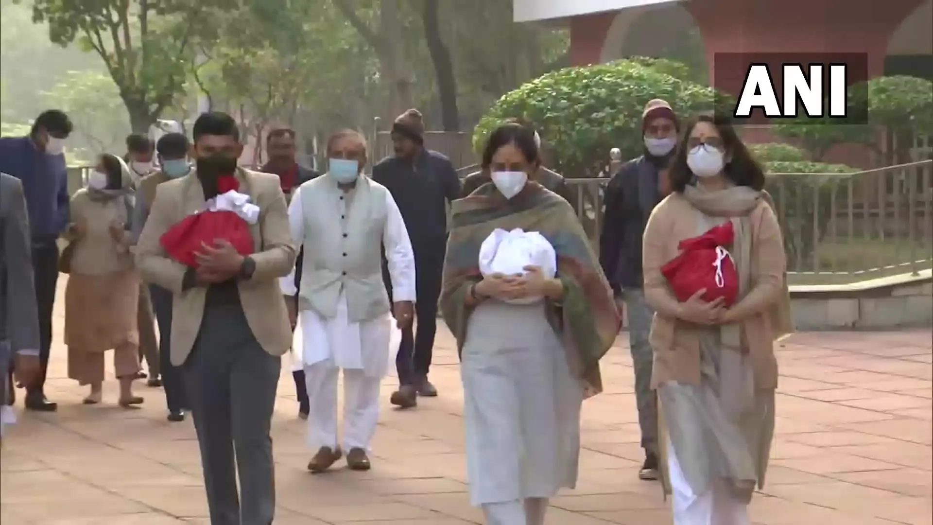 Kritika and Tarini, the daughters of General Rawat and Madhulika Rawat collect the ashes of their parents | Photo: ANI