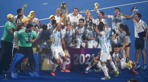 Argentine players jubilate with the trophy after beating Germany in the final | PTI