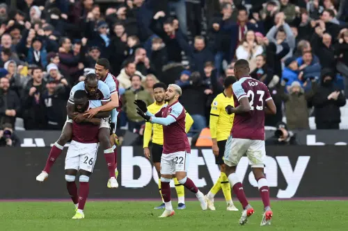 Arthur Masuaku (L) celebrates with team mates | AFP