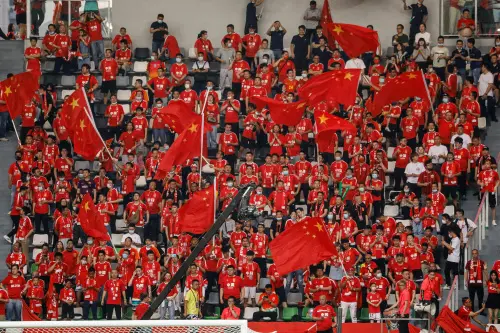 China's football fans cheer for their team | AFP