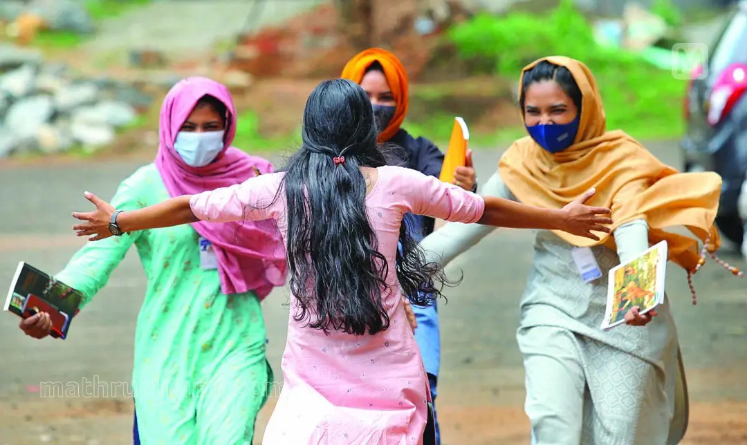 Students of Malappuram government college excited over meeting their friends after a long break | Photo: Mathrubhumi